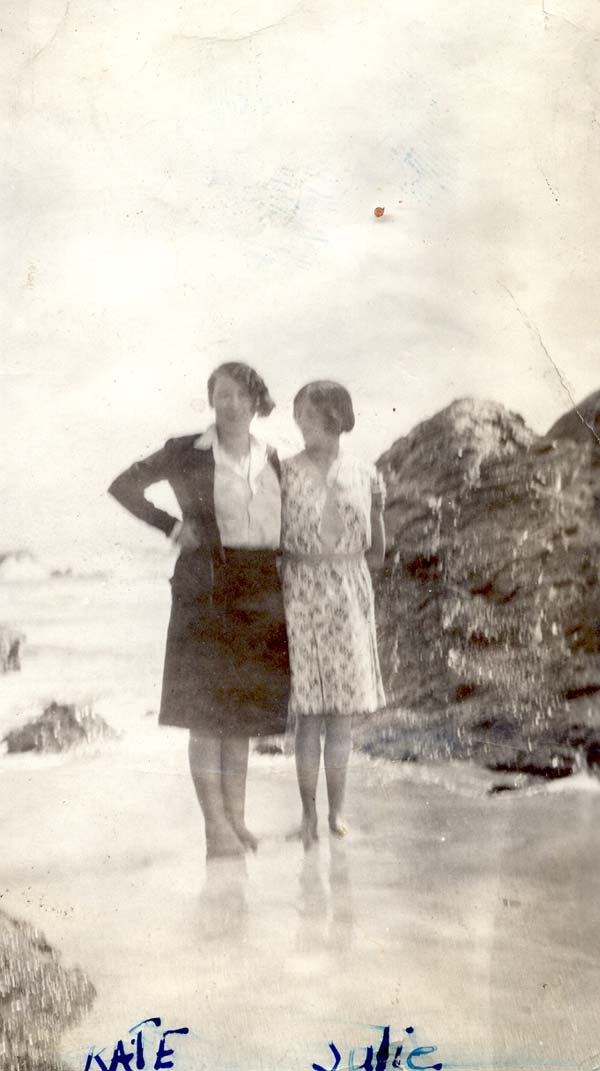 Katie and Julia standing on a beach